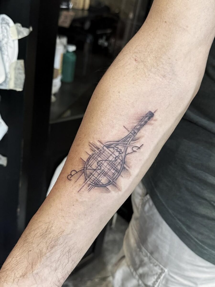 Stylish tennis racket globe tattoo Piece Tattoo Design