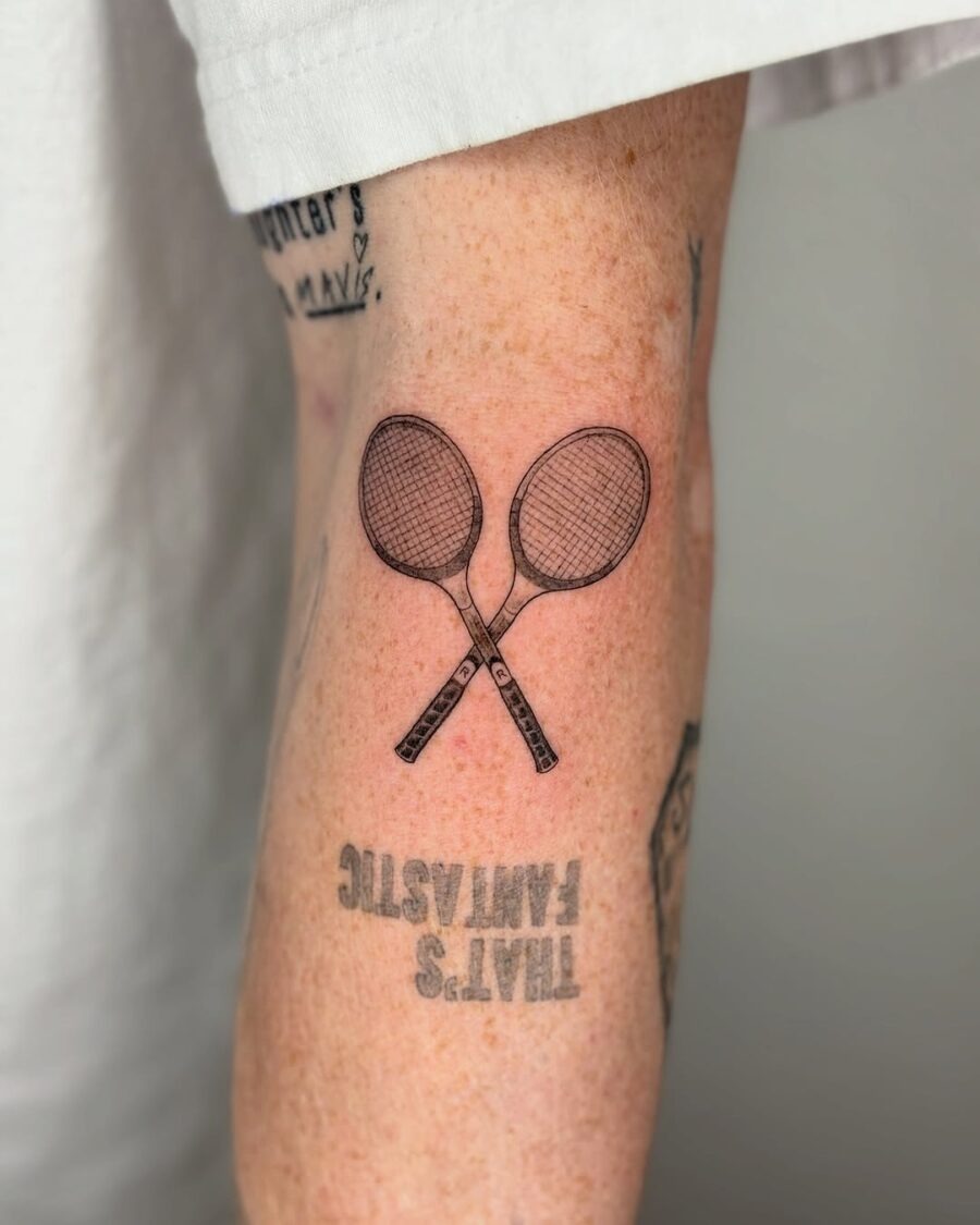 Stylish tennis rackets inked on the arm Tattoo Design