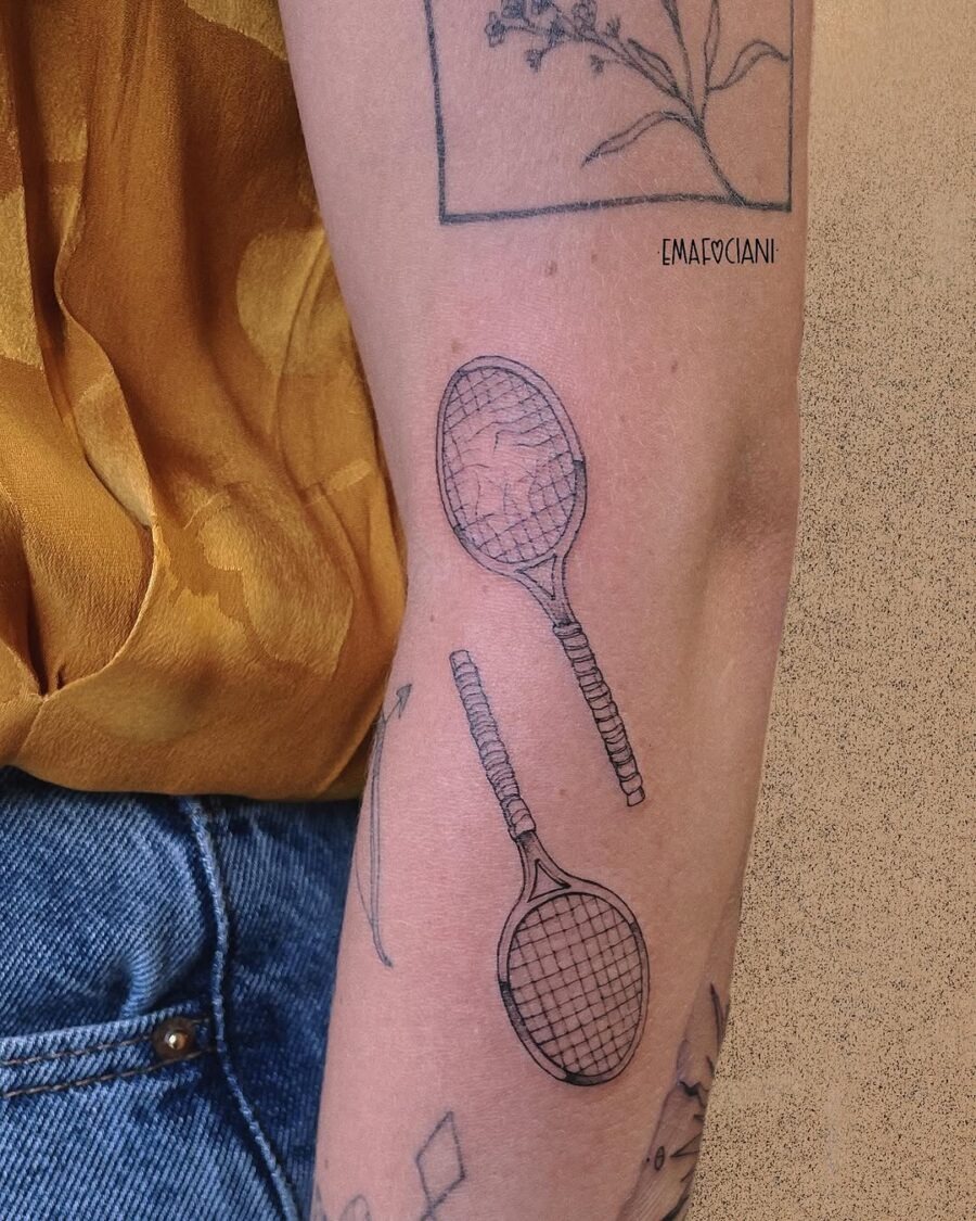Stylish tennis rackets tattooed on arm Tattoo Design