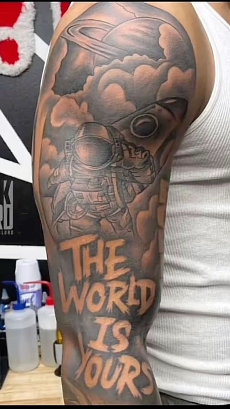 Astronaut in the Clouds Sleeve Tattoo Design