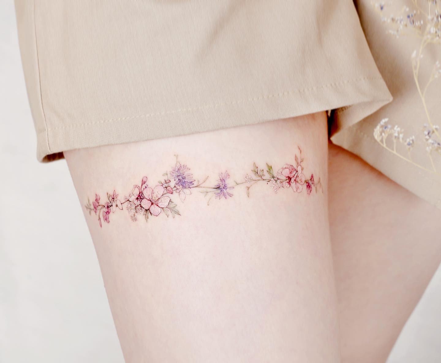 Delicate Wildflower Garland Thigh Band Tattoo Tattoo Design