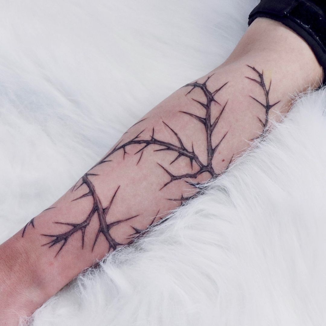 Branching Forearm Thorn Design That Feels Like Living Ink, a tattoo design rendered in clean detailed linework.