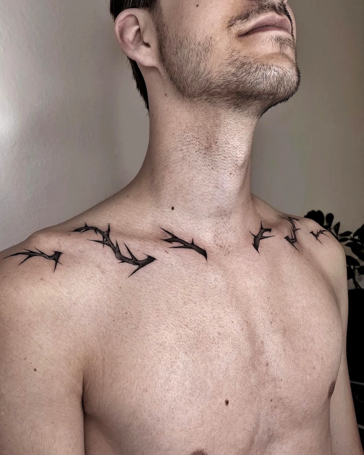 Collarbone Thorn Line With Sharp Editorial Energy, a tattoo design rendered in clean detailed linework for the shoulder.