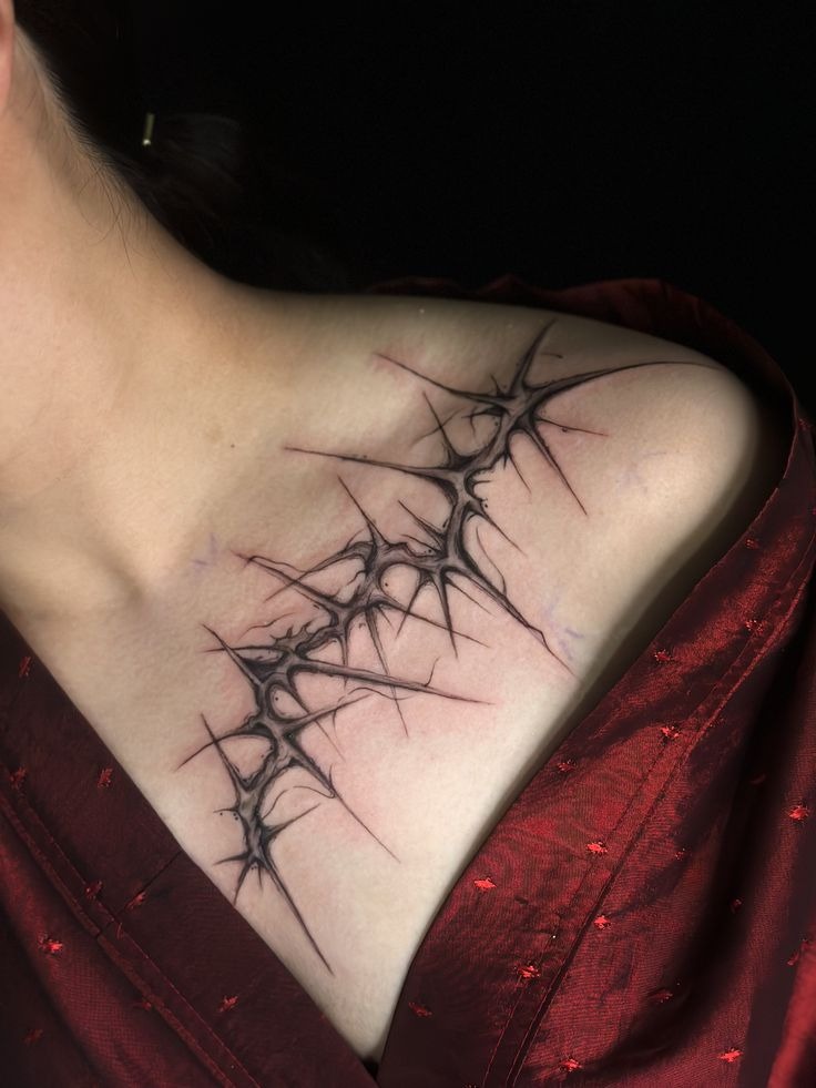 Delicate Collarbone Thorn Branch With a Soft Dangerous Twist, a tattoo design rendered in clean detailed linework.