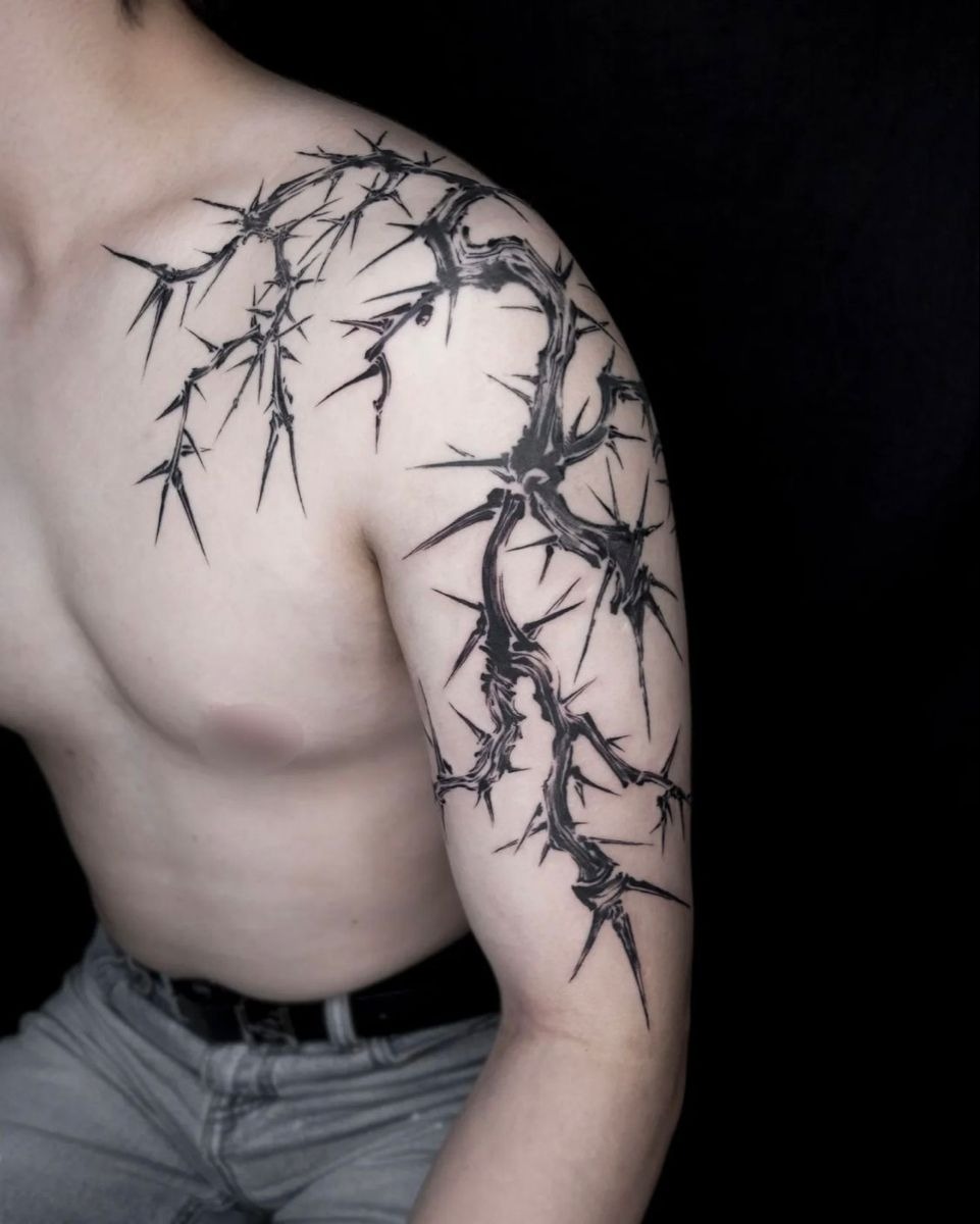 Flowing Shoulder-to-Arm Thorn Sleeve With Elegant Movement, a tattoo design rendered in clean detailed linework.