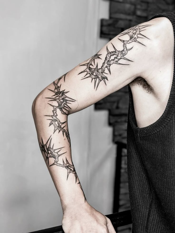 Fragmented Thorn Sleeve for an Artistic Arm Wrap Look, a tattoo design rendered in clean detailed linework.