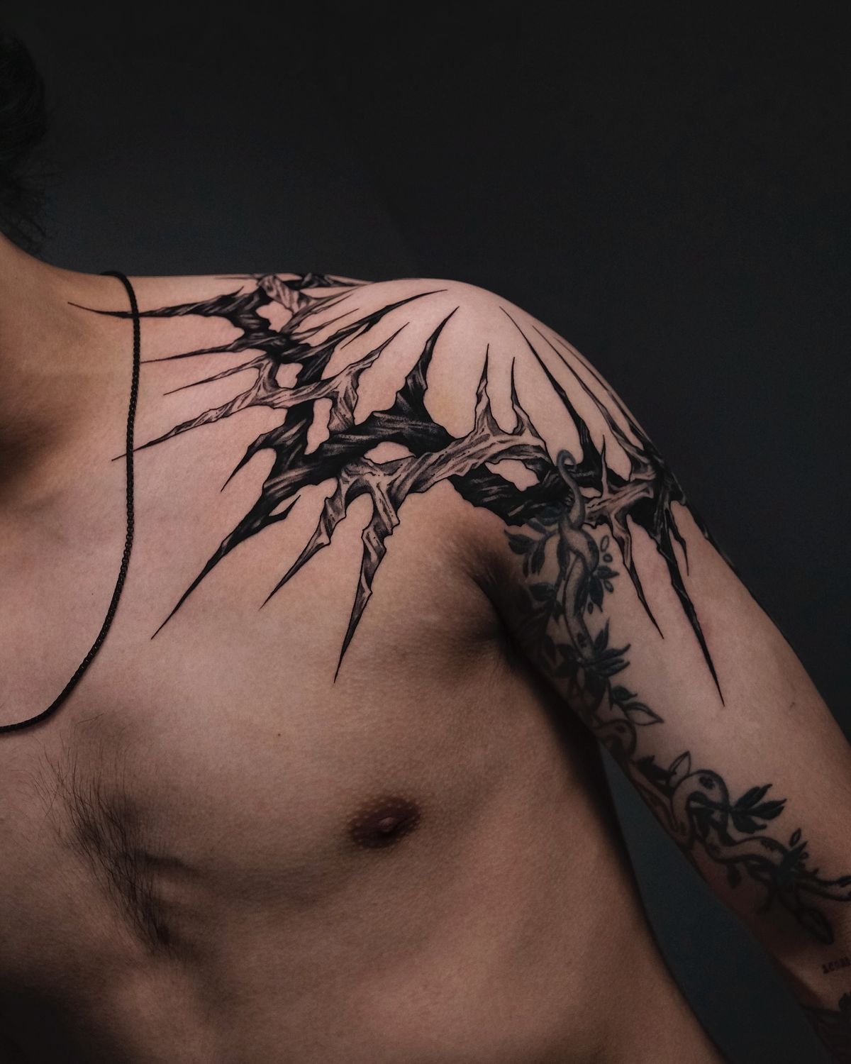 Shattered Thorn Shoulder Piece With Fierce Protective Energy, a tattoo design rendered in bold.