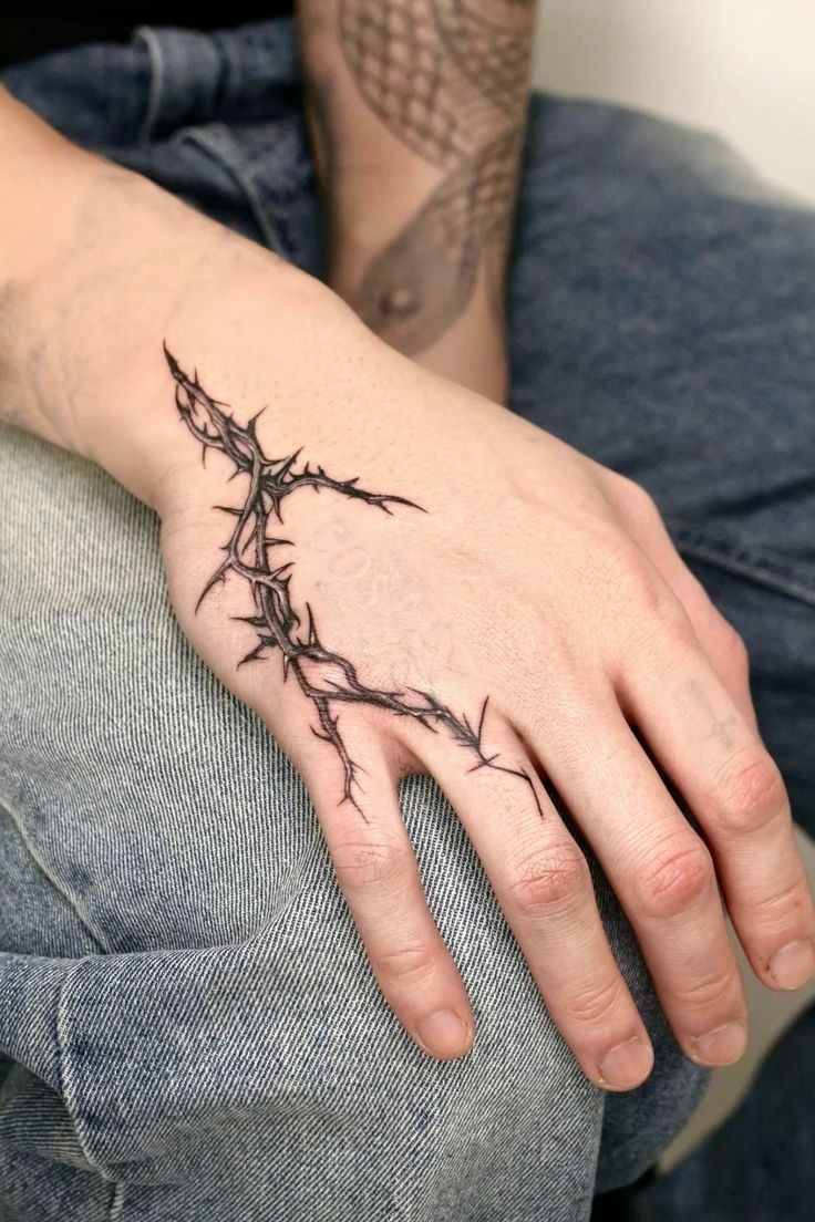 Thorn Hand Design With Sharp Minimalist Impact, a tattoo design rendered in clean detailed linework.