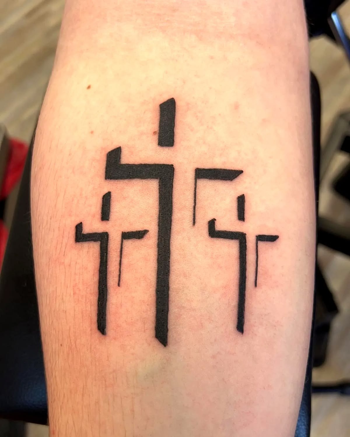 Geometric Three-Cross Blackwork Tattoo Tattoo Design