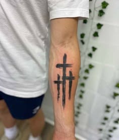 Minimal Brushstroke Forearm Three-Cross Tattoo Tattoo Design