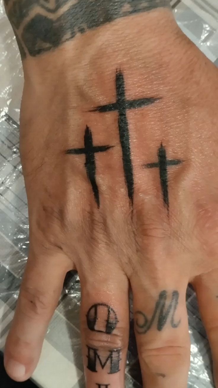 Minimal Three-Cross Hand Tattoo Tattoo Design