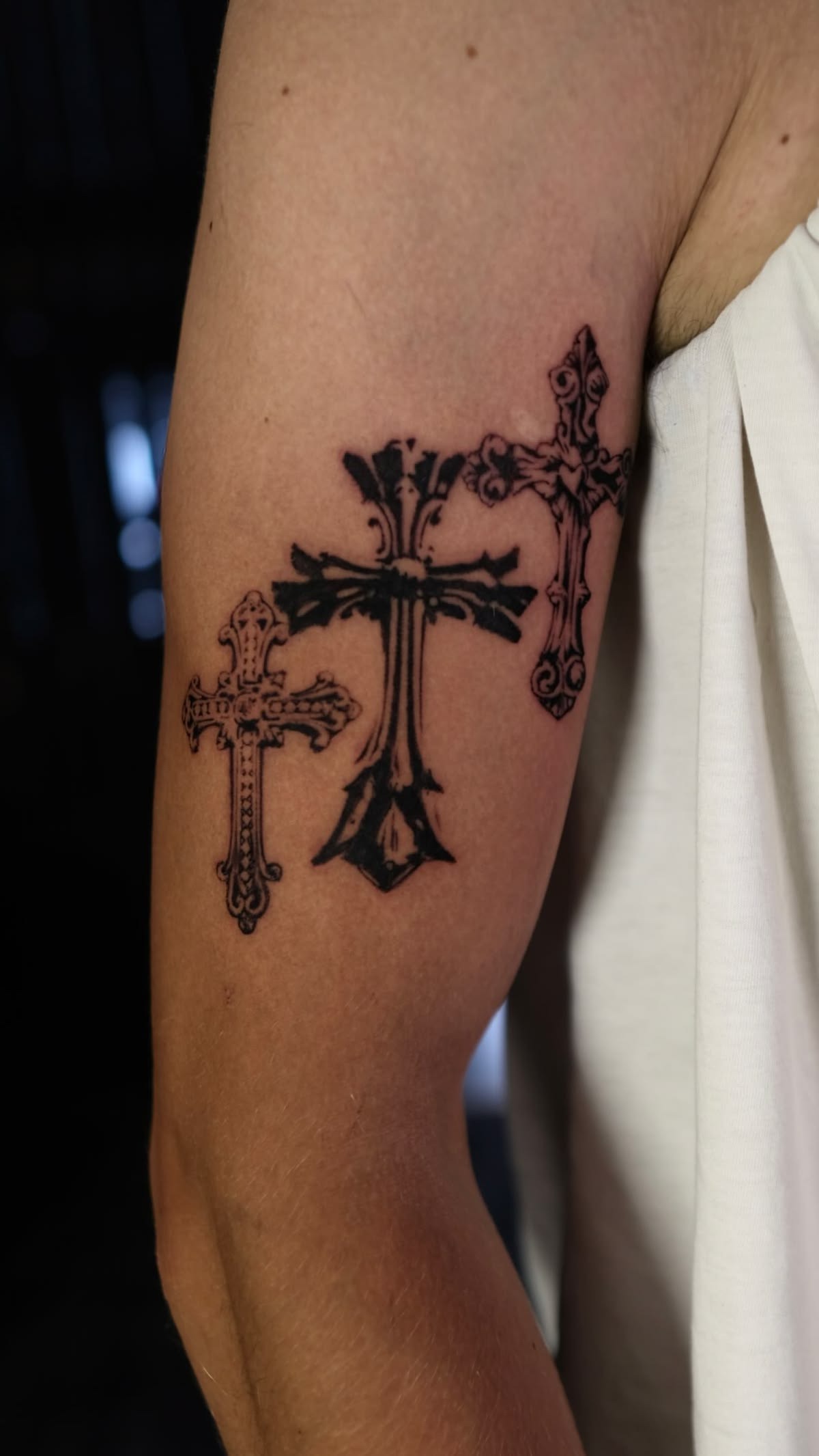 Ornate Three-Cross Upper Arm Tattoo Tattoo Design