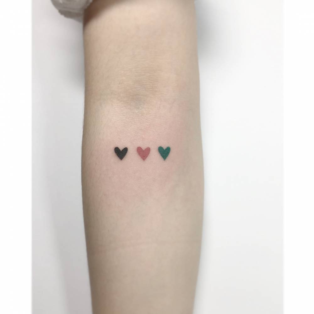 Colorful Trio of Hearts Tattoo on the Forearm Tattoo Design