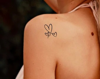 Delicate Shoulder Blade Hearts with Personal Flair Tattoo Design