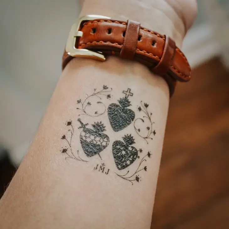 Intricate Sacred Hearts Tattoo on the Forearm Tattoo Design