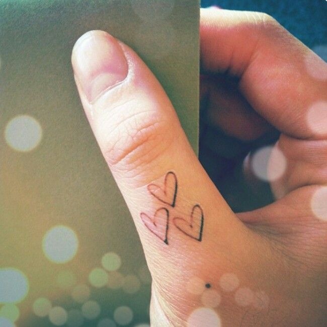Minimalist Three Hearts Tattoo on the Thumb Tattoo Design