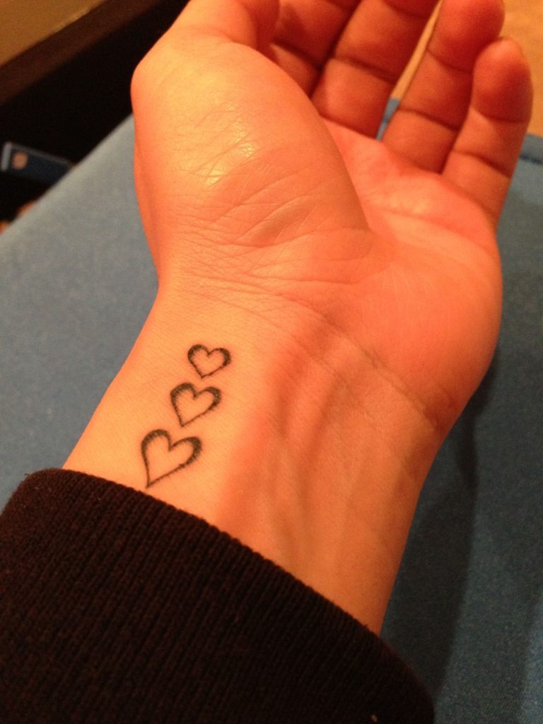 Vertical Hearts Tattoo on the Wrist Tattoo Design