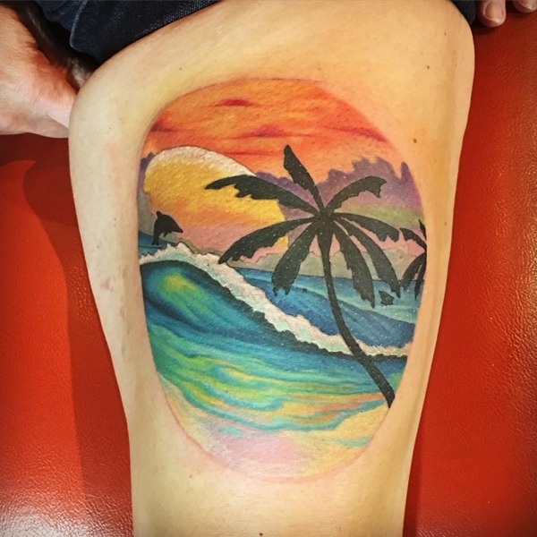 Sunset Over the Ocean With Dolphin Tattoo Design