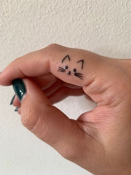 Tiny Cat Thumb Tattoo Tattoo Design