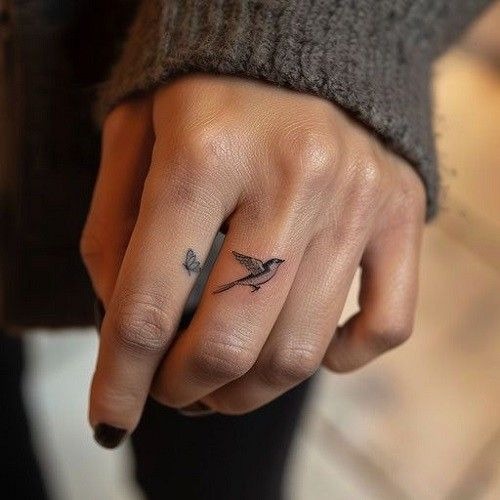 Tiny Swallow Hand Tattoo Tattoo Design