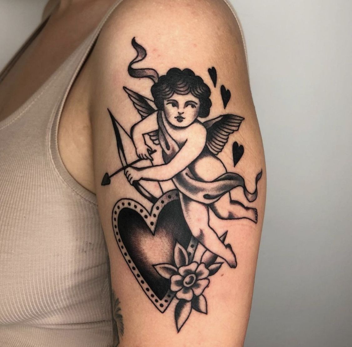 Cupid with Heart-Tipped Arrow Tattoo Design