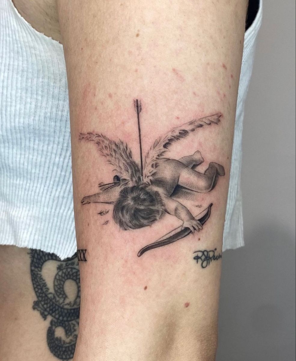 Fallen Cupid with Arrow and Feathers Tattoo Design