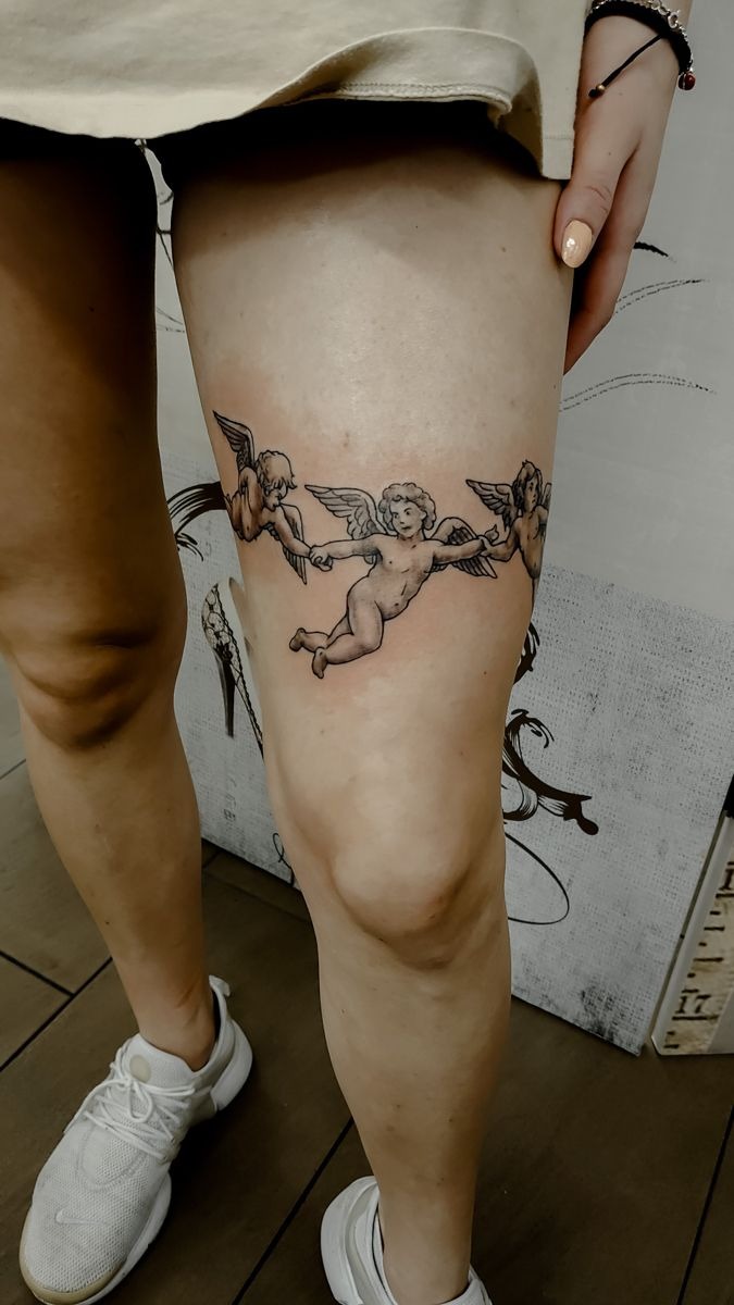 Three Cherubs Holding Hands Around the Thigh Tattoo Design