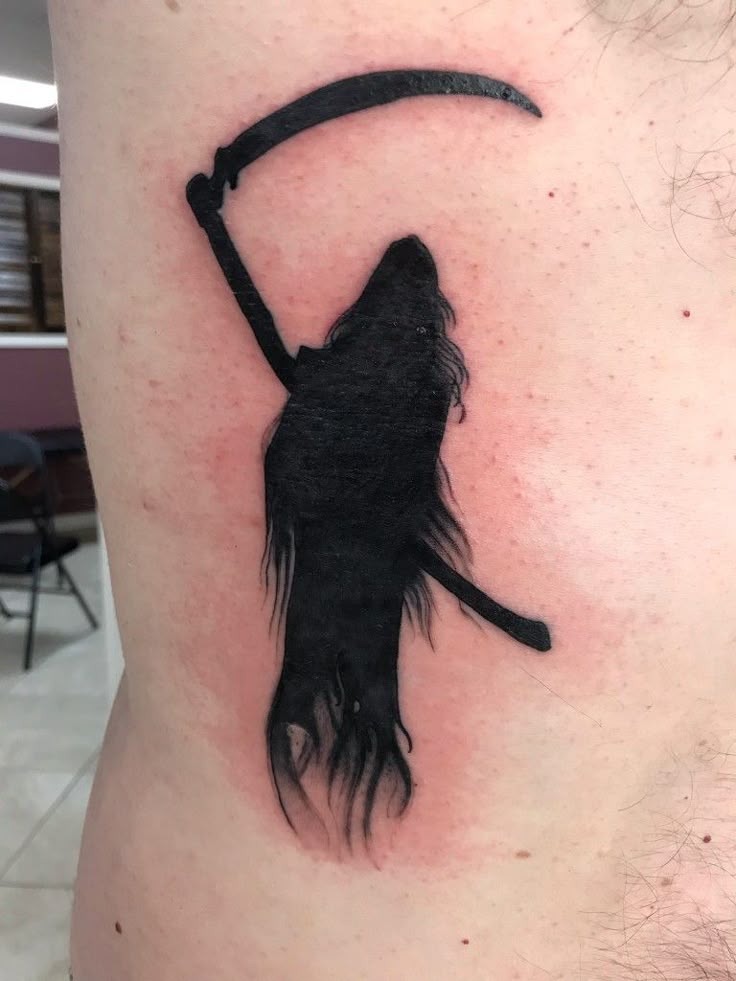 The Minimalist Shadow Reaper Tattoo Design