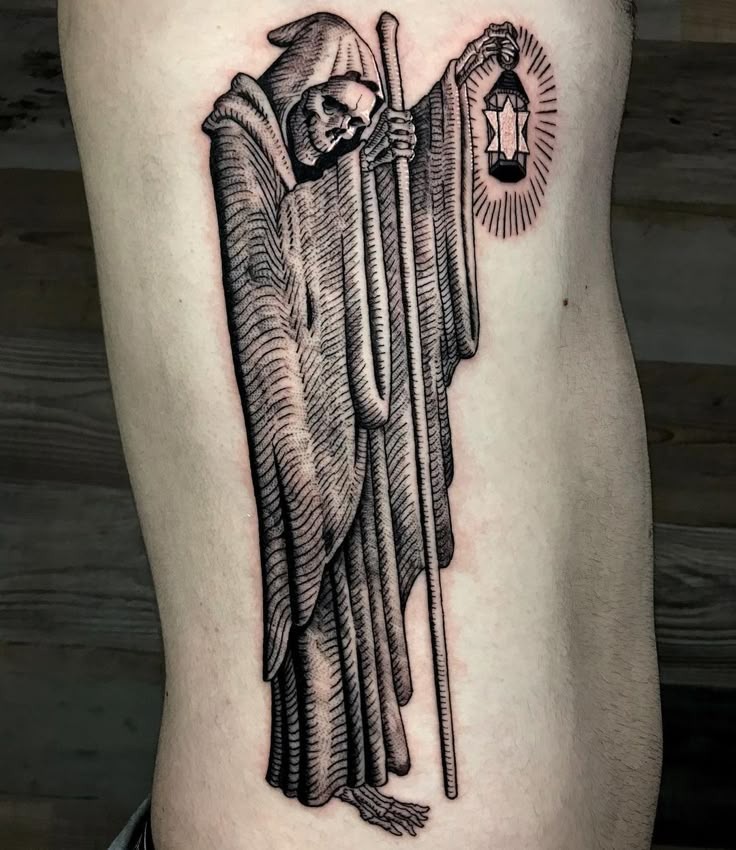 The Traditional Reaper with a Lantern Tattoo Design