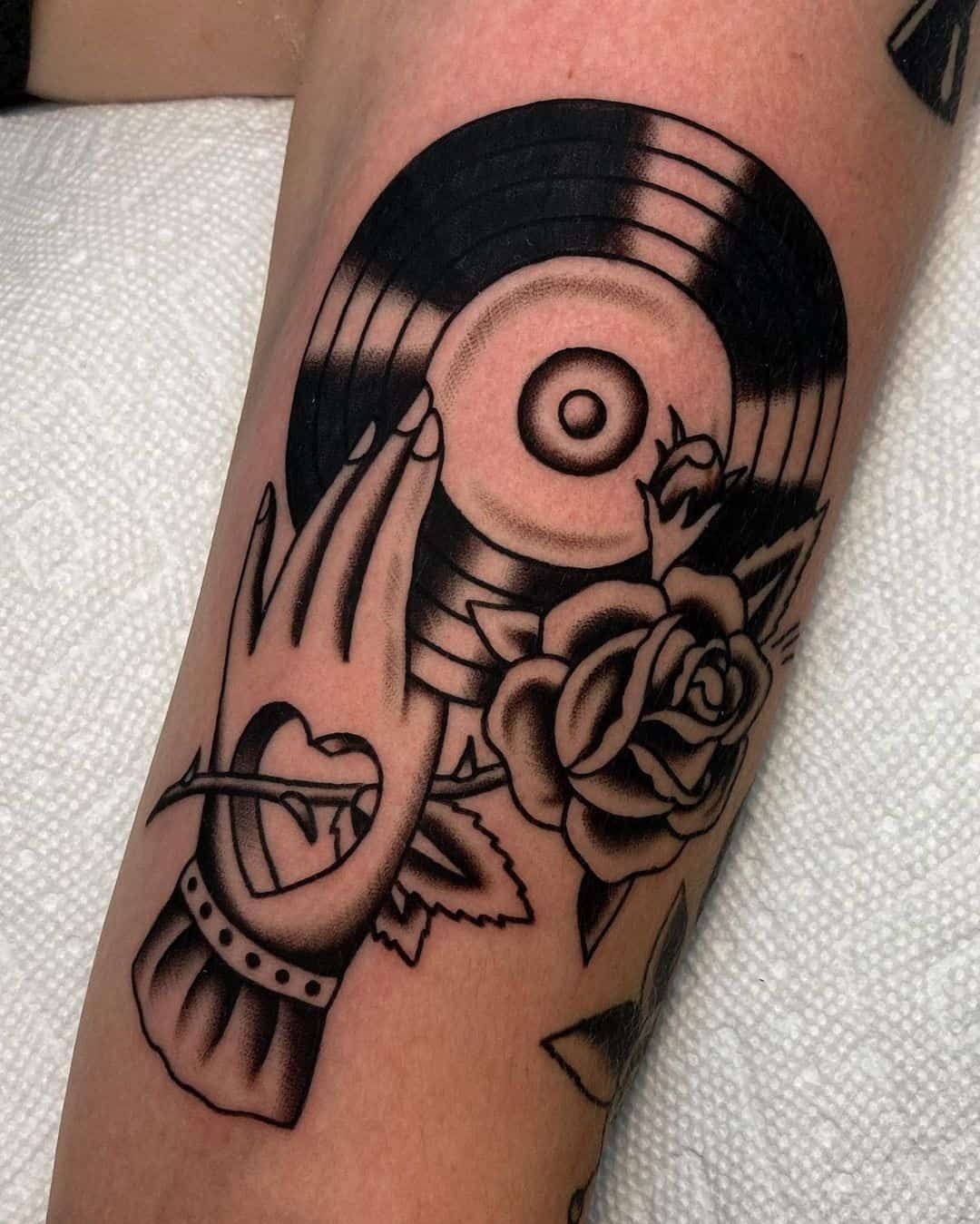 Record & Hand Vintage Groove Tattoo Design