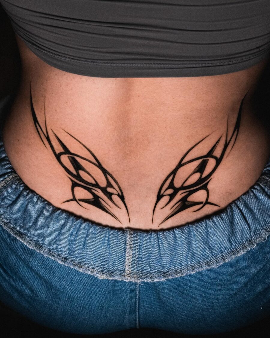 Bold black flame design accentuating the lower back Tattoo Design