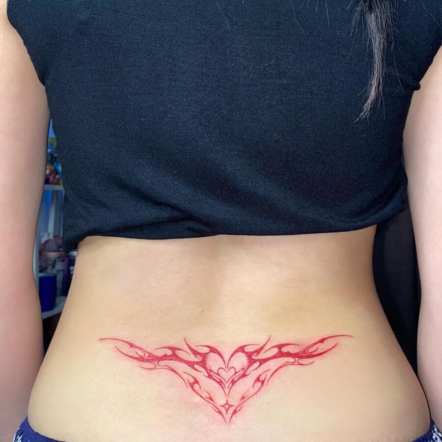 Bold red flame design on the lower back Tattoo Design