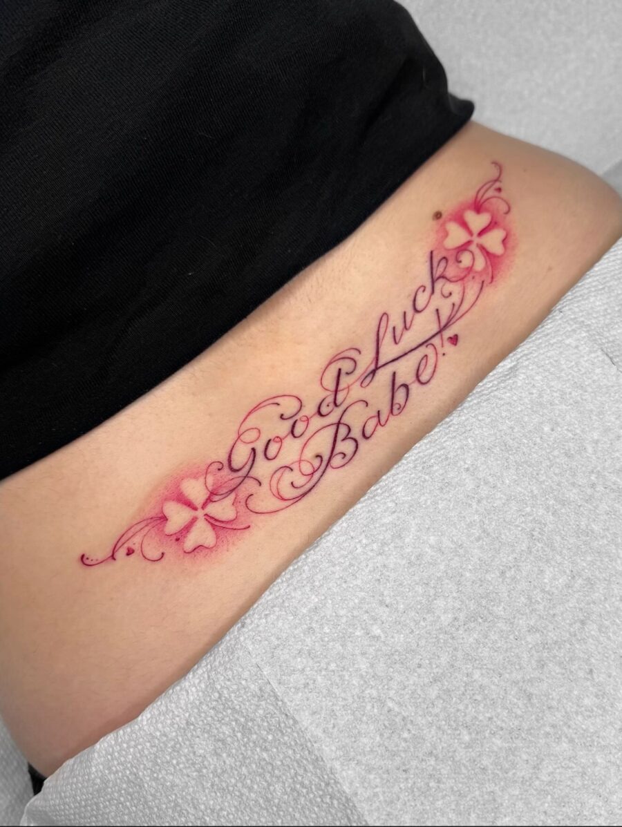 Delicate flower-script tramp stamp design Tattoo Design