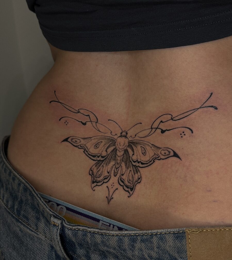 Elegant butterfly tattoo gracing the lower back Tattoo Design