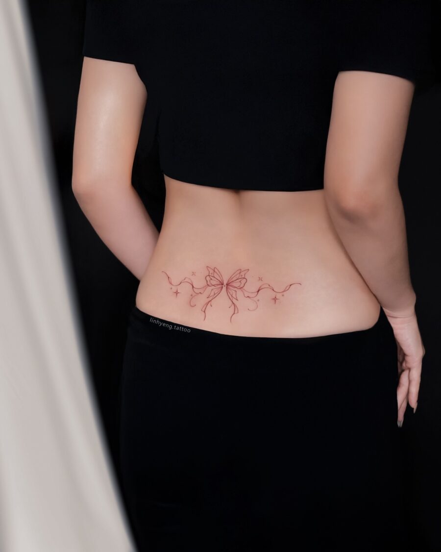 Elegant butterfly tramp stamp design in red ink Tattoo Design