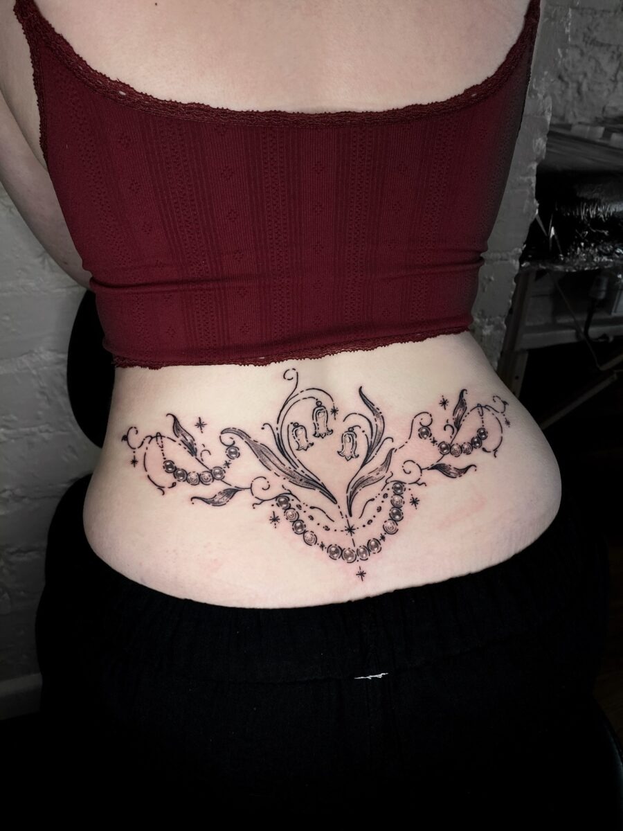 Elegant floral tramp stamp tattoo design Tattoo Design