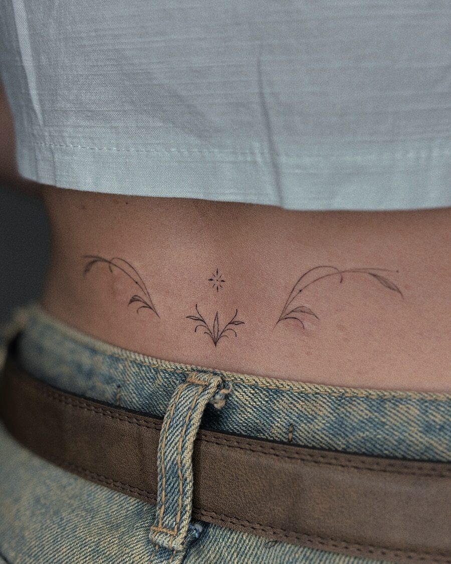 Elegant floral tramp stamp tattoo design Tattoo Design