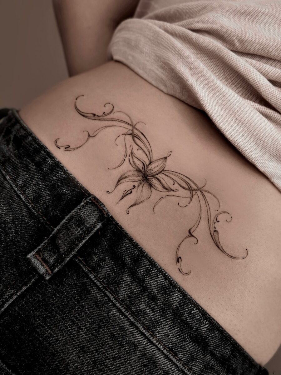 Elegant floral tramp stamp tattoo design Tattoo Design