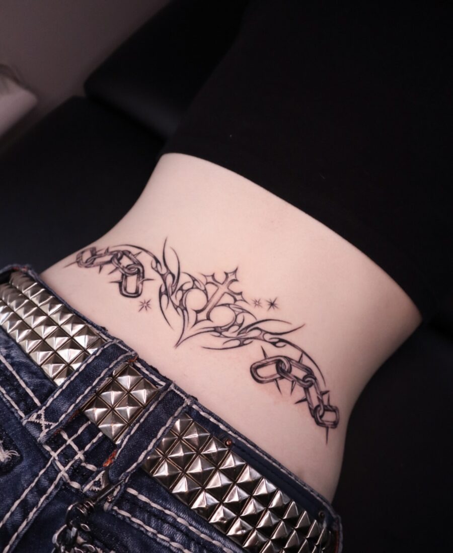 Elegant floral tramp stamp with chained design Tattoo Design