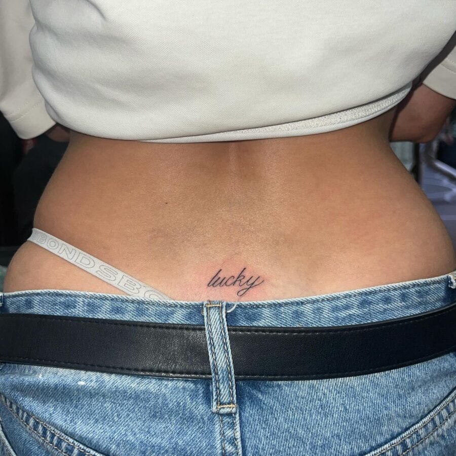 Elegant lucky script tramp stamp tattoo design Tattoo Design