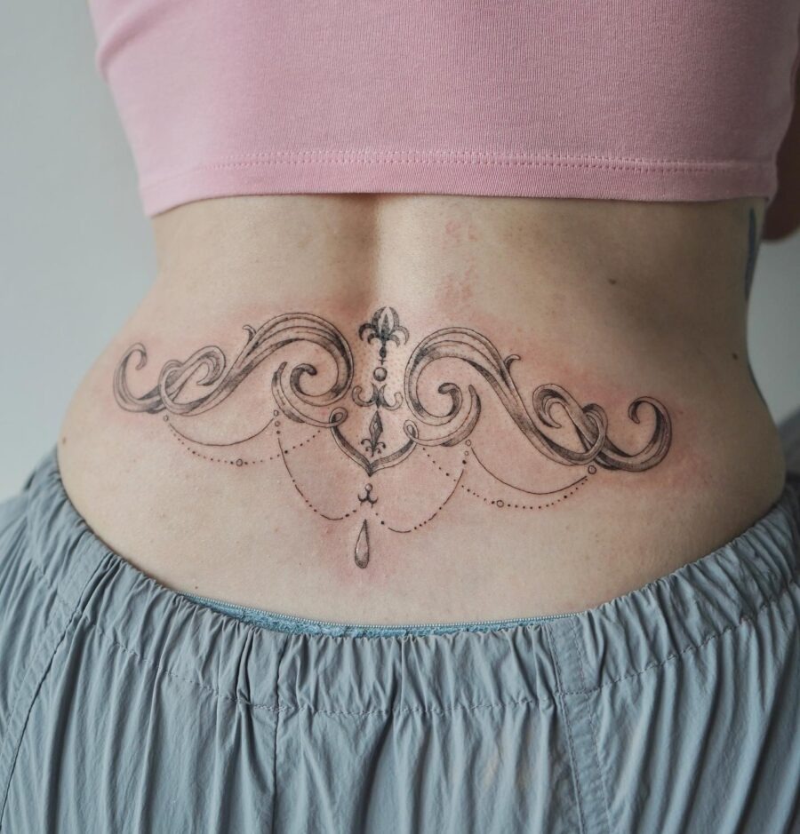 Elegant Swirls and Whimsical Details on Skin Tattoo Design
