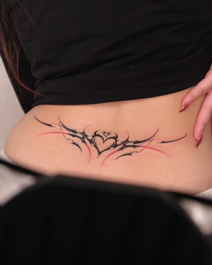 Elegant winged heart design on lower back Tattoo Design