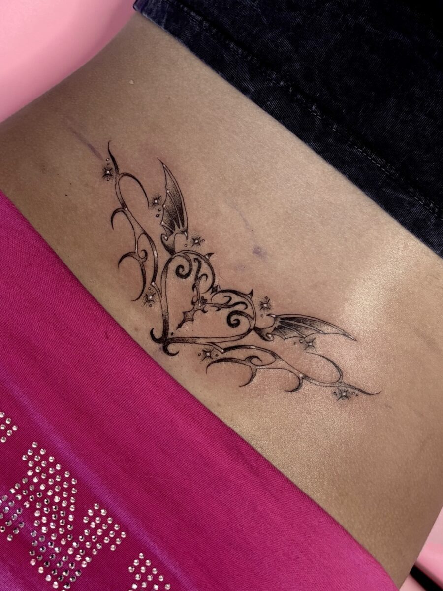 Intricate tramp stamp with whimsical bat details Tattoo Design