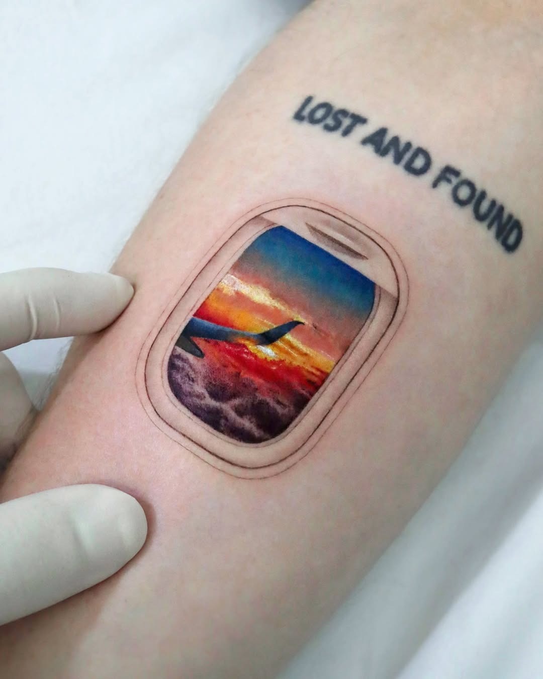 A stunning plane window sunset tattoo Tattoo Design