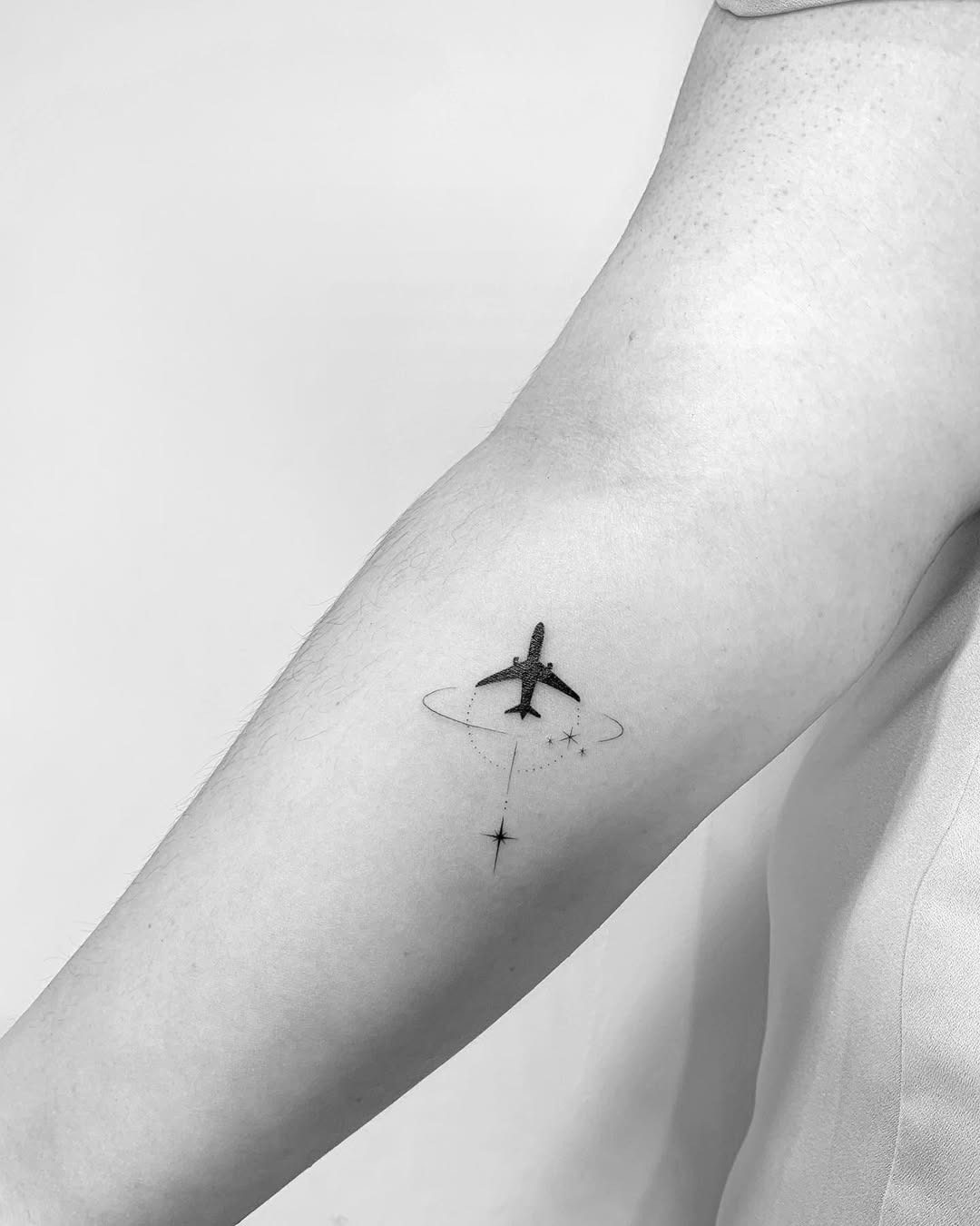 Minimalist airplane tattoo for wanderlust souls Tattoo Design