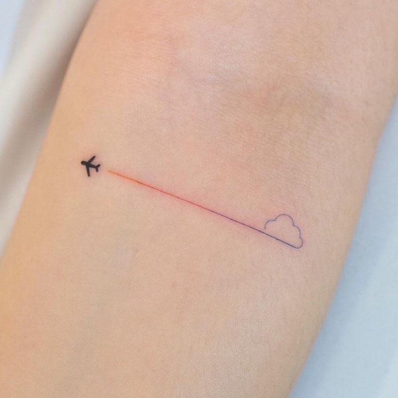 Minimalist airplane tattoo with a cloud Tattoo Design