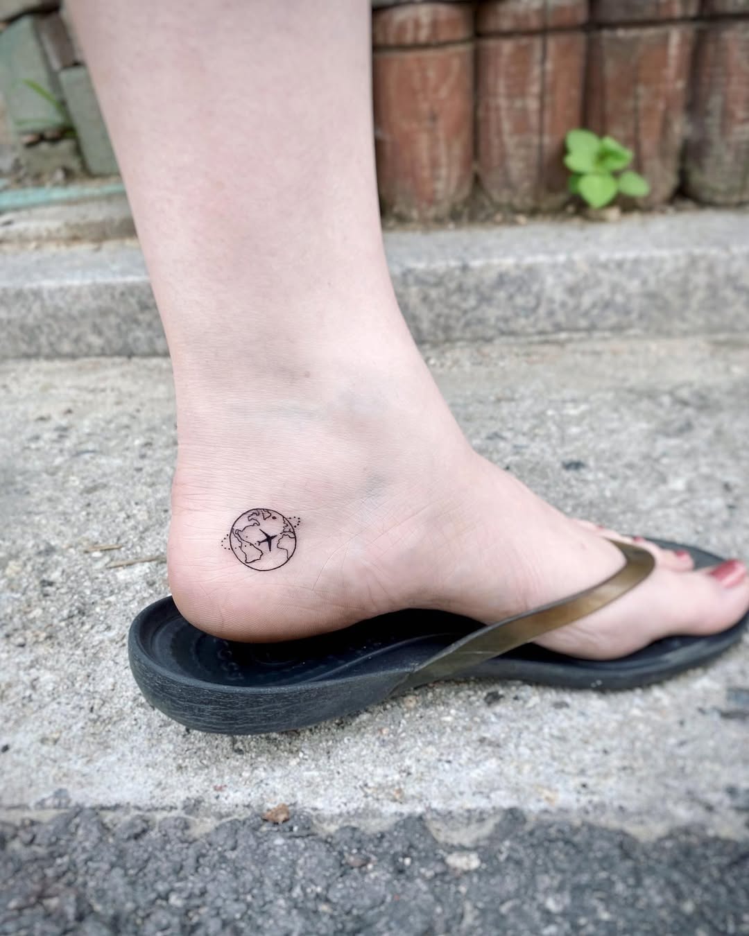 Minimalist Earth Tattoo on Ankle Tattoo Design