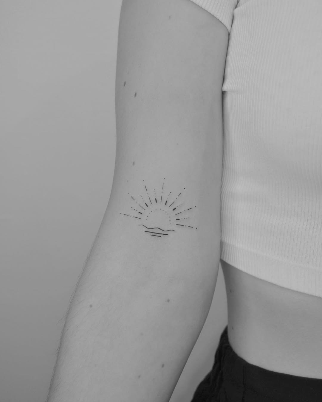 Minimalist sun tattoo radiating positivity Tattoo Design