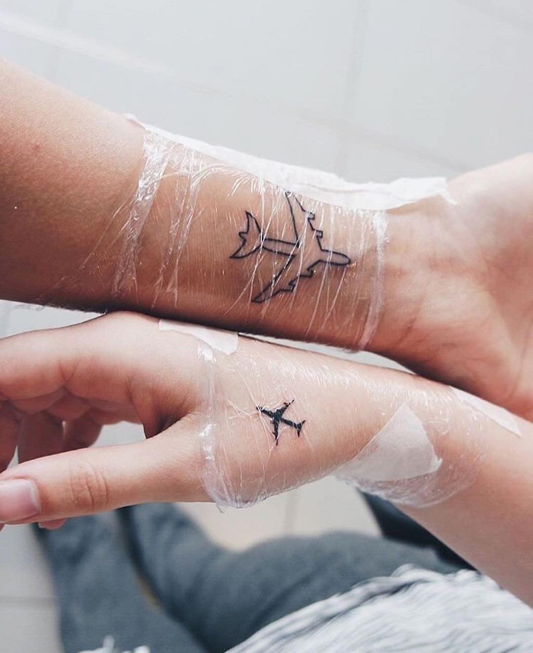 Symbolic tattoos celebrating travel and friendship Tattoo Design