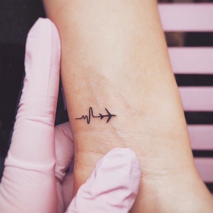 Symbolic travel tattoo blending heartbeat and airplane Tattoo Design